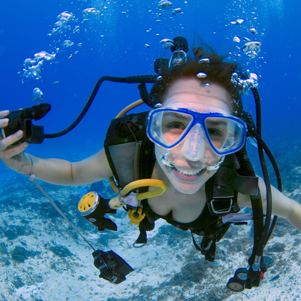 A confident scuba diver smiling